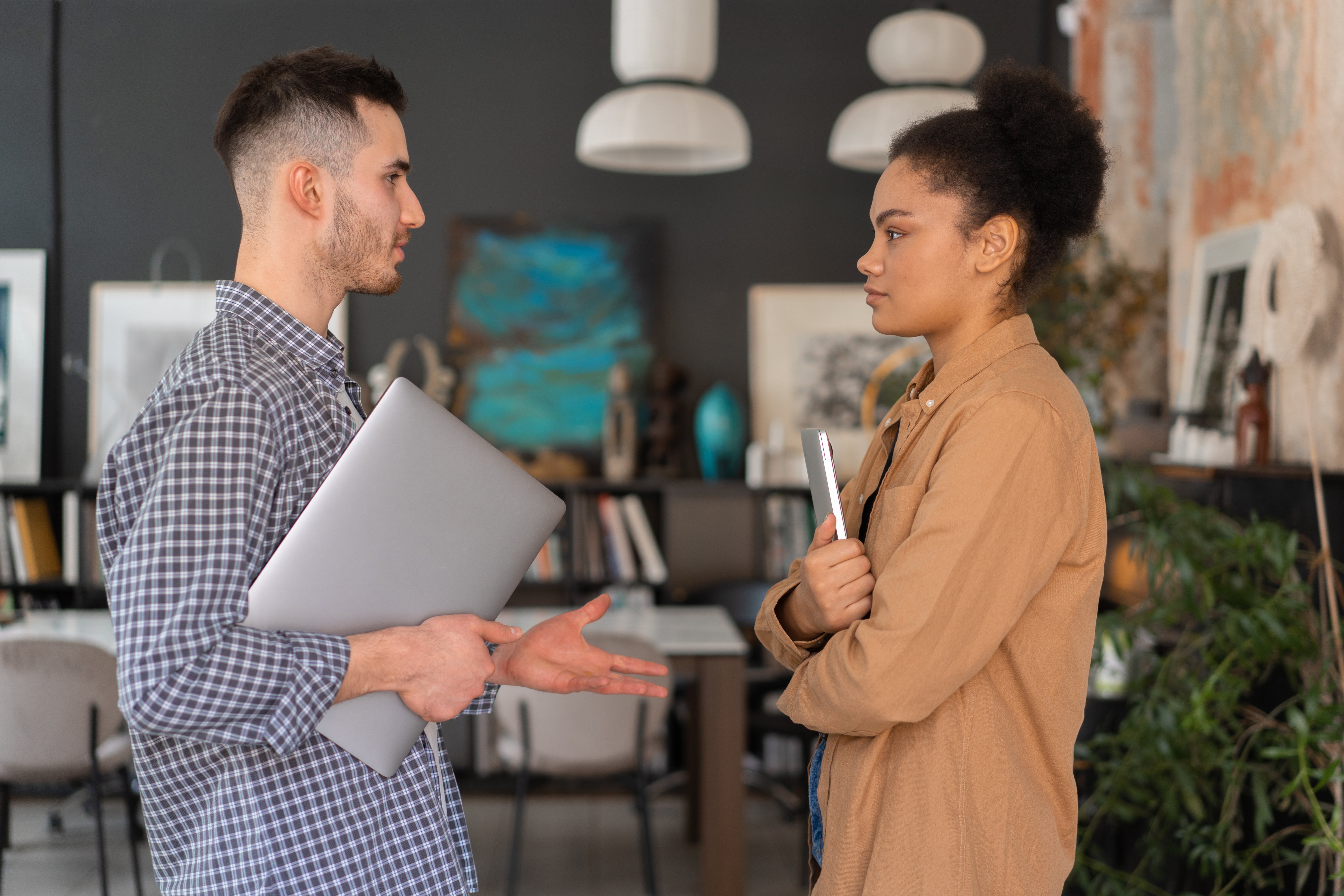 Two colleagues talking in an office